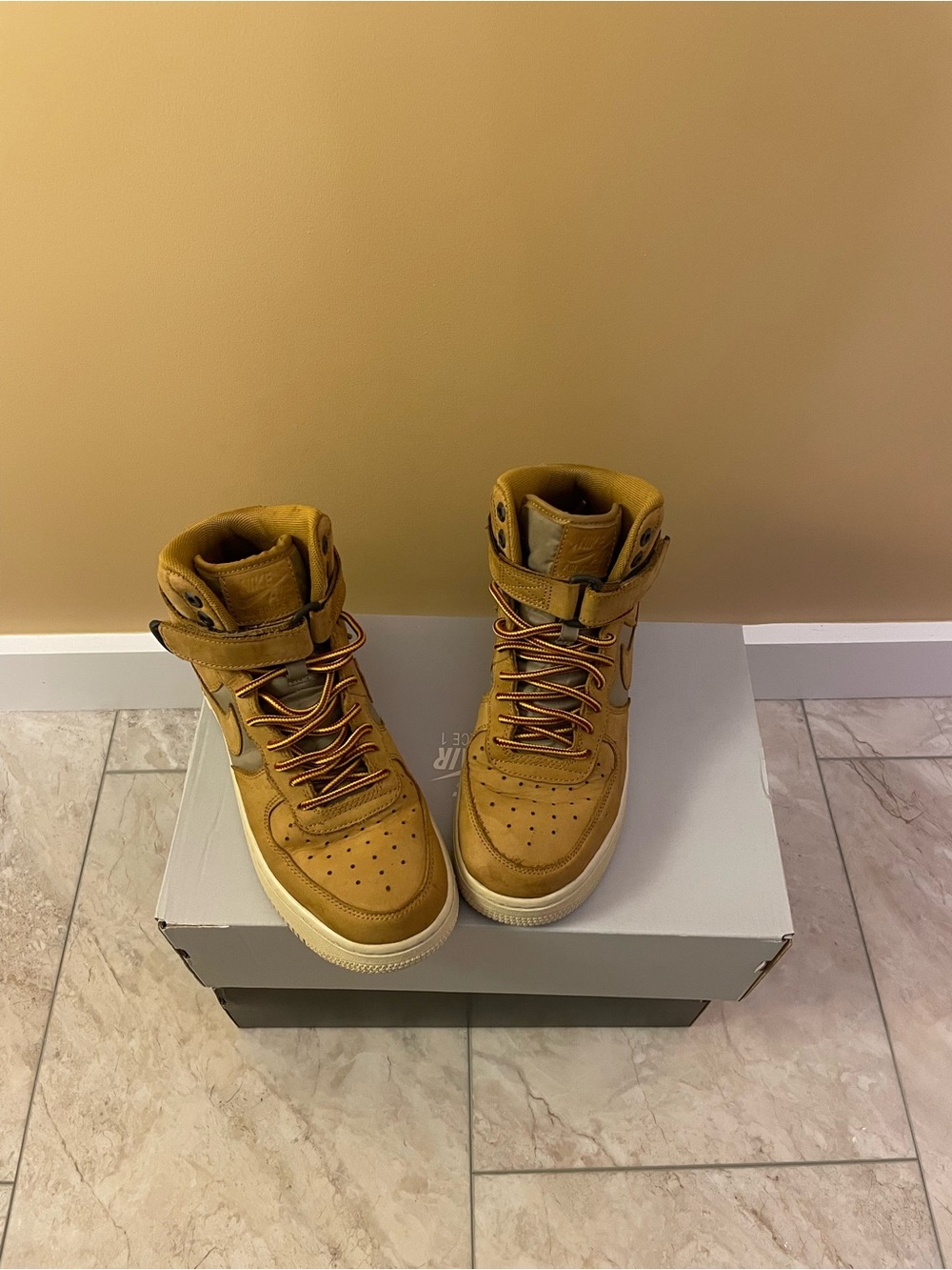 Wheat/Gray Air Force One High Top.  (youth 5.5 approximately fits woman’s 7)